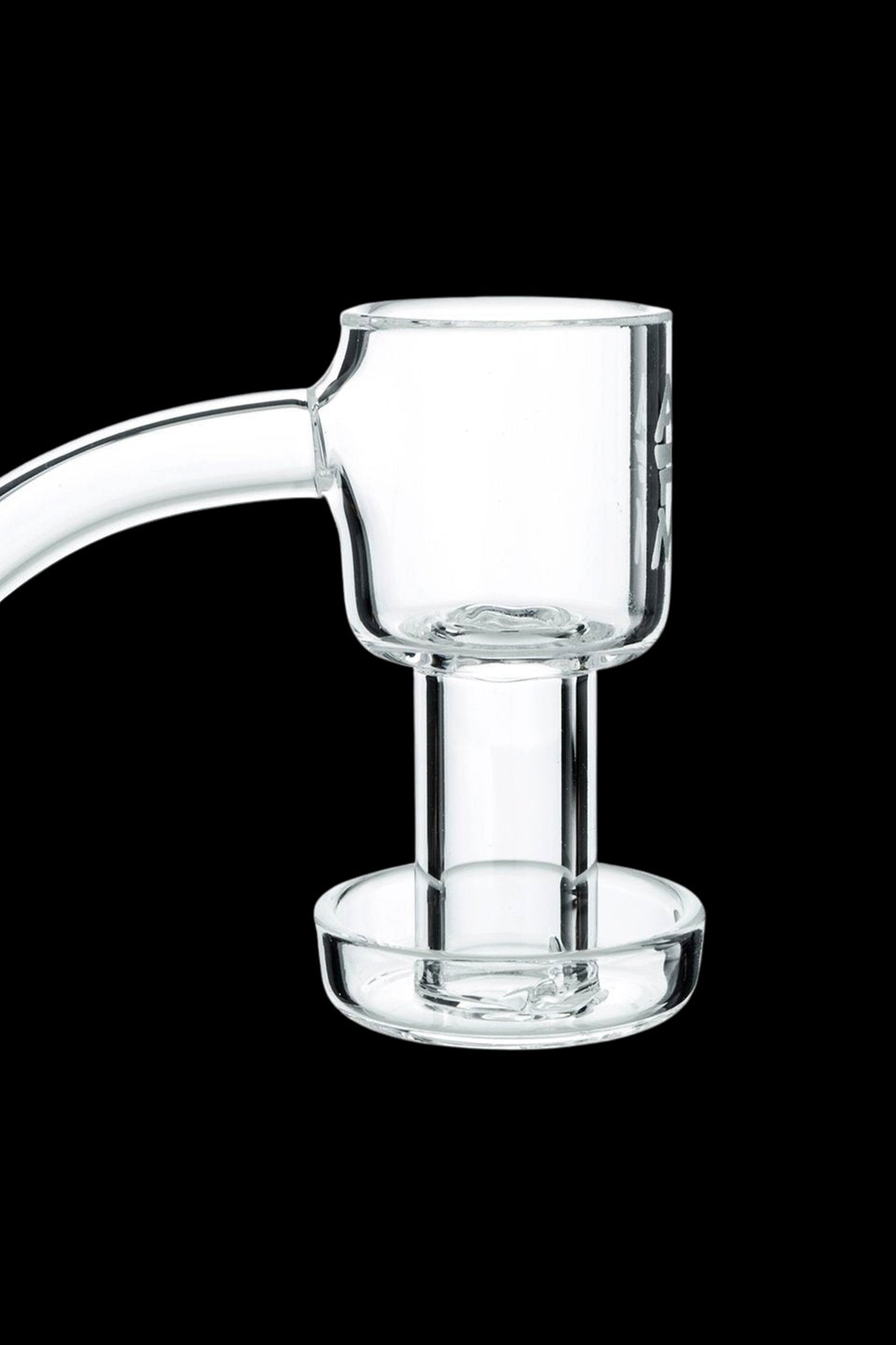 Clear quartz dab rig insert against a black background.