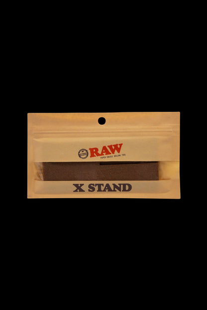 Wooden rolling box for cannabis with “RAW” and “X STAND” branding.