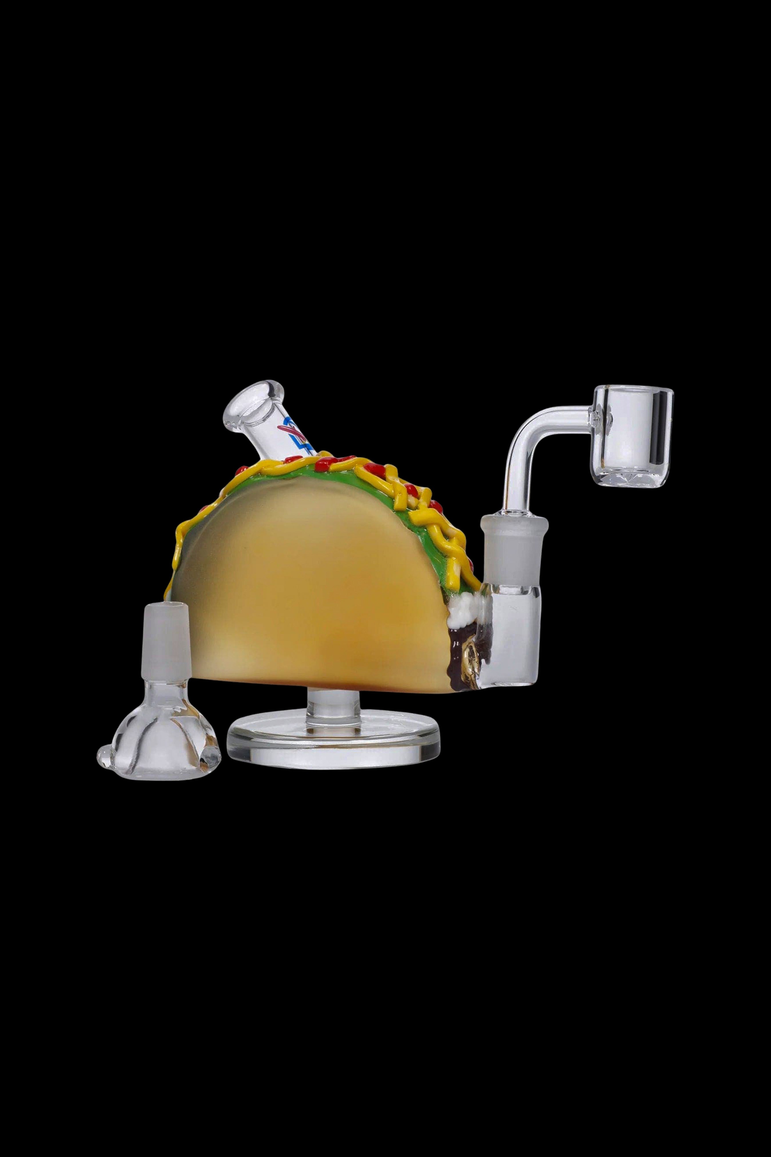 Glass rig shaped like a taco with a quartz banger, studio shot on black.