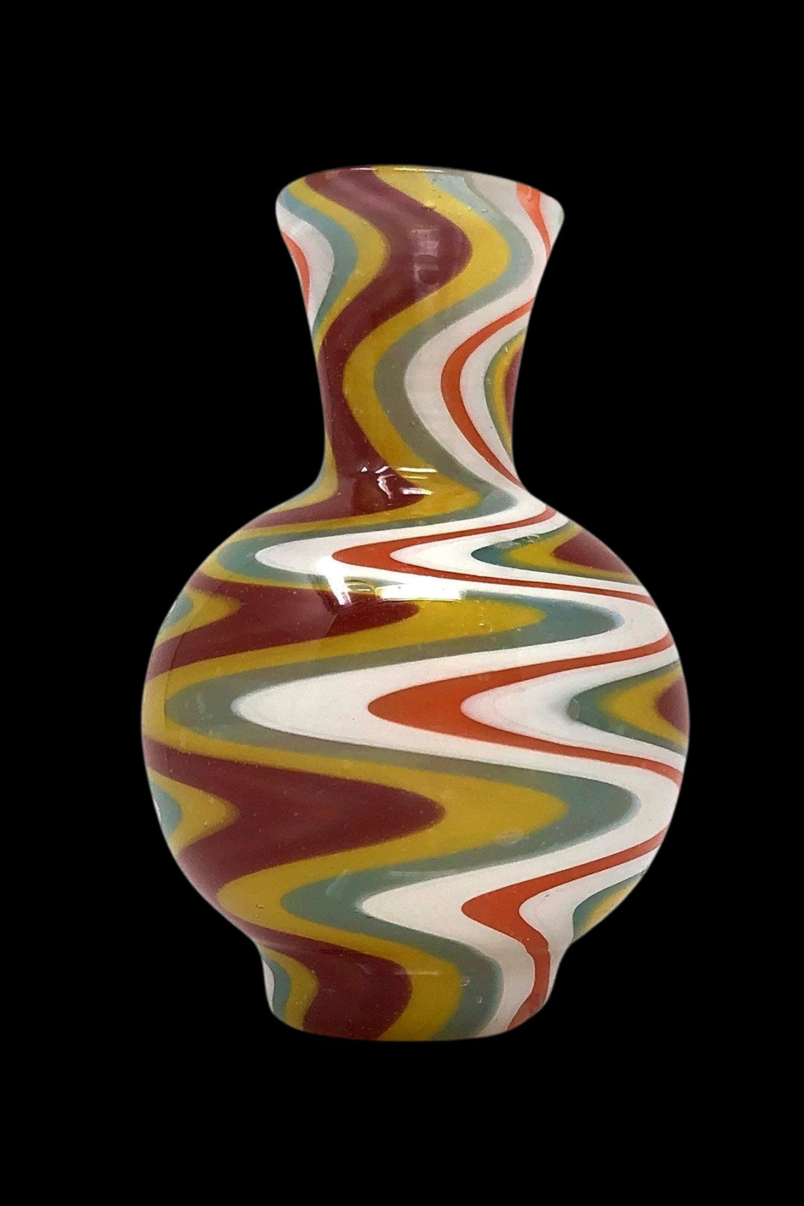 Colorful glass water pipe with swirling red, yellow, and green patterns.