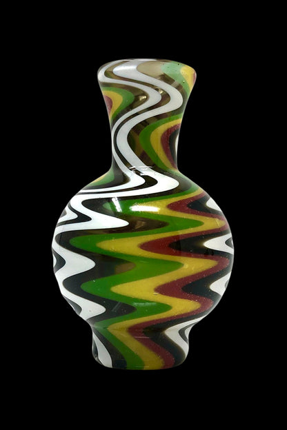 Colorful glass water pipe with swirling green, red, and yellow patterns on a black background.