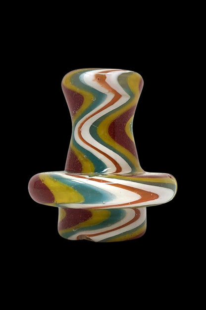Hand-blown glass cannabis oil dome with colorful swirling patterns.