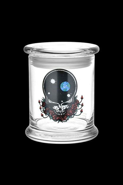 Glass storage jar with a skull and roses design featuring a globe within the skull's eye socket.