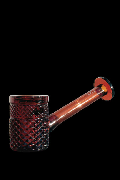 Red glass bubbler with textured base.