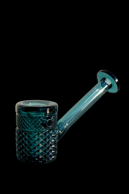 Teal glass bubbler with textured body and flared mouthpiece, isolated on black.