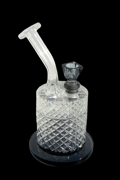 Glass water pipe with diamond-patterned body and removable downstem, isolated on a black surface.