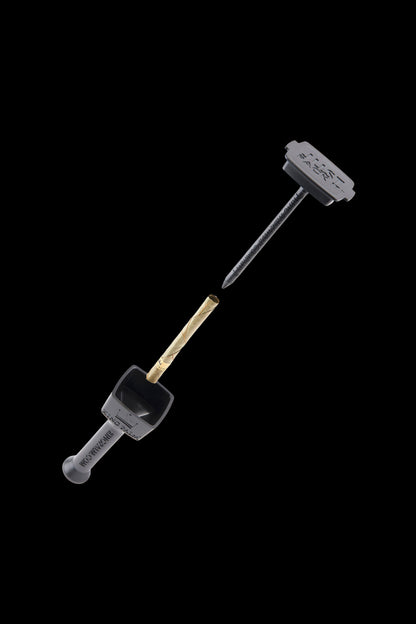 Black cannabis dab tool with a lit joint.