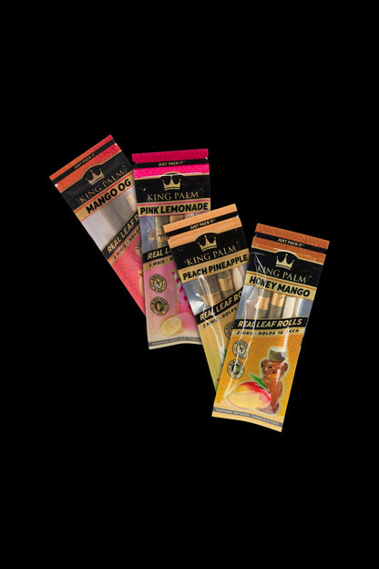 A stack of colorful King Palm pre-rolled leaf wraps in various fruit flavors like mango, peach pineapple, and pink lemonade, displayed against a black background. 