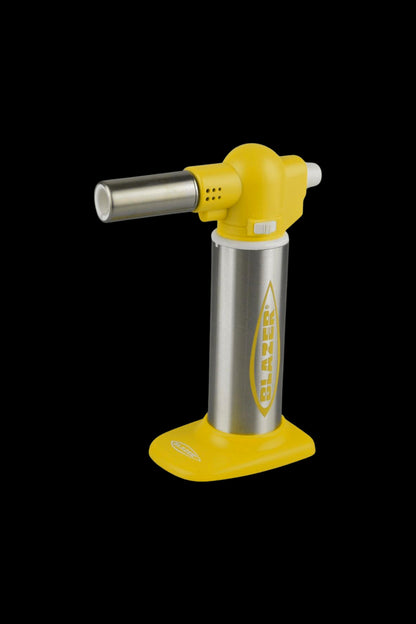 Yellow butane torch for dabbing cannabis concentrates.