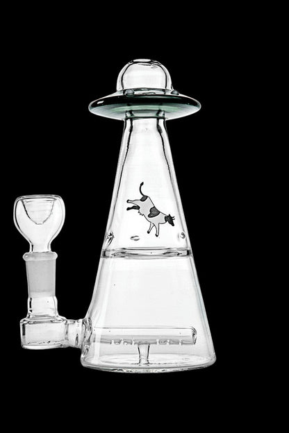 Clear glass rig shaped like a UFO with a dog graphic, accompanied by a glass bowl.