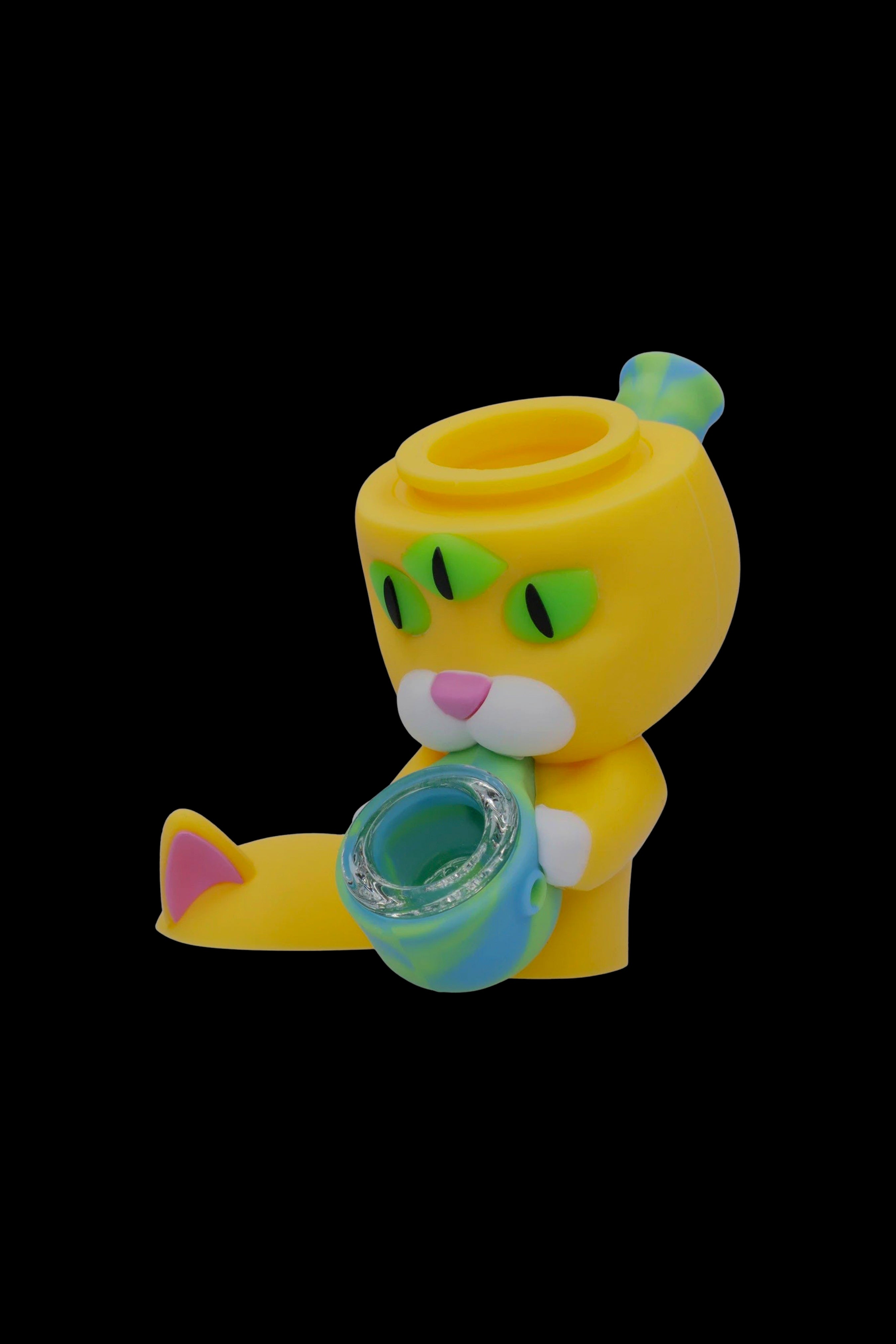 Yellow glass pipe shaped like a cartoon cat with a green bowl.
