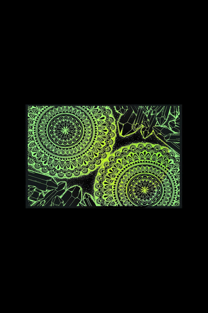 Glowing green mandala pattern with crystal shapes on a black background.