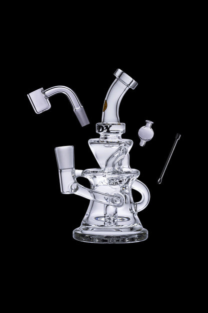 Clear glass dab rig with accessories, isolated on a black background.