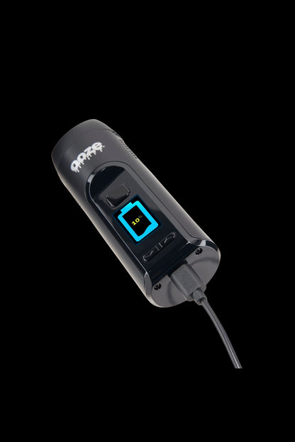 A black and silver cannabis vaporizer with a digital display showing 10% battery life.