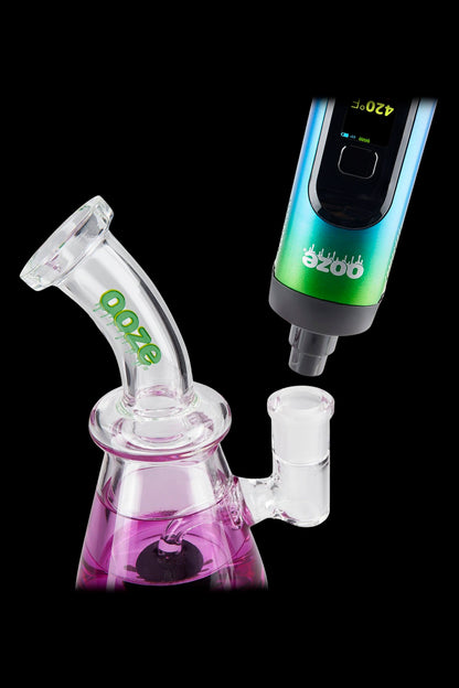 Ooze vaporizer pen connected to a glass water pipe.