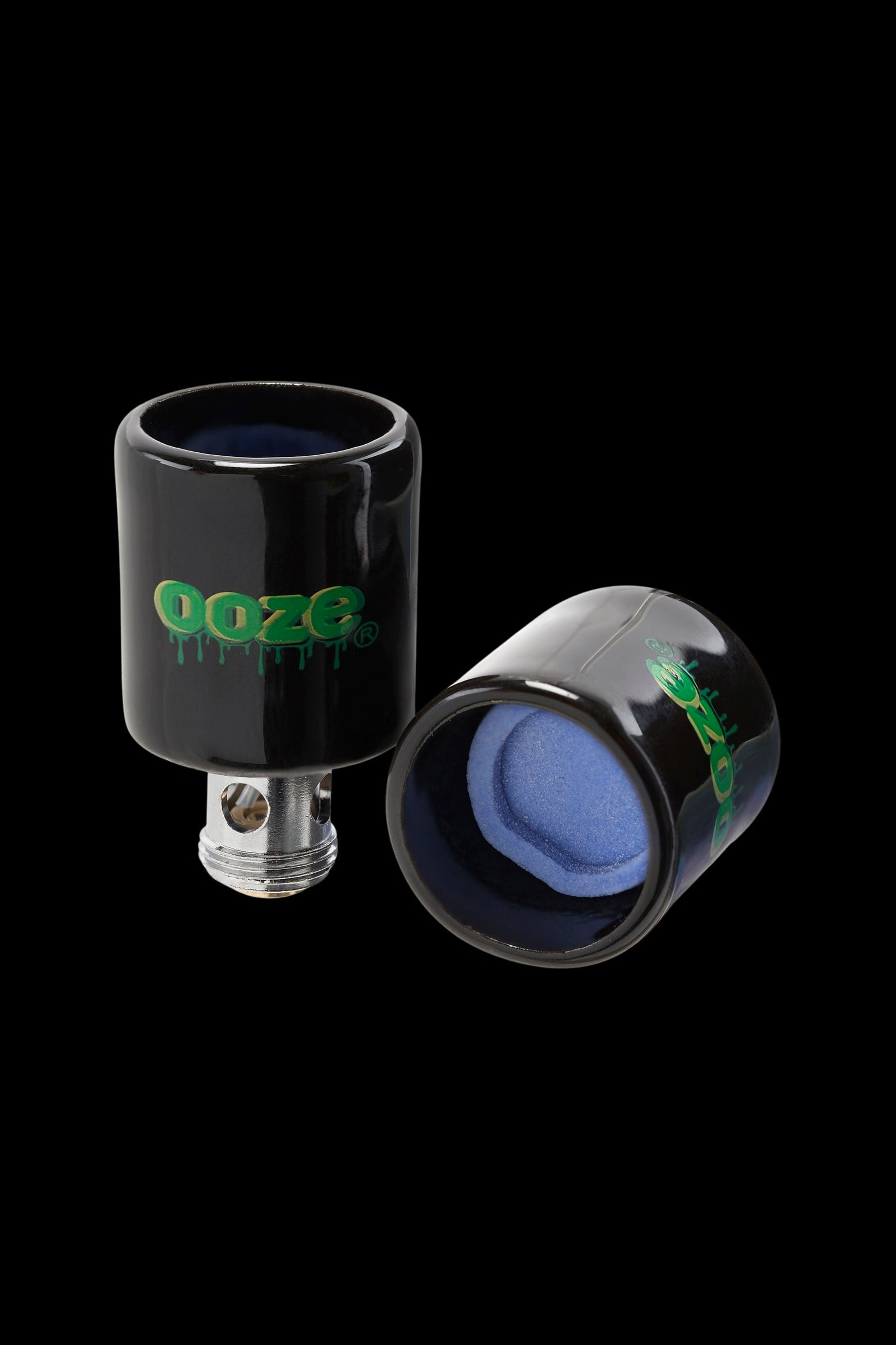 Ooze cannabis oil rig attachment with dripping green logo and blue glass.