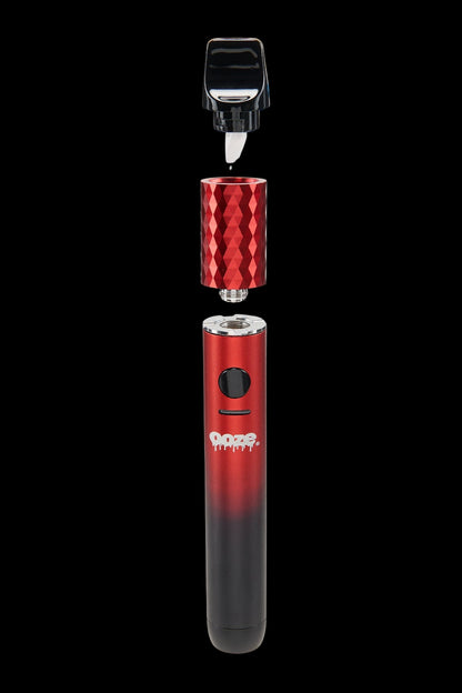 Red and black cannabis vaporizer pen with disassembled components.