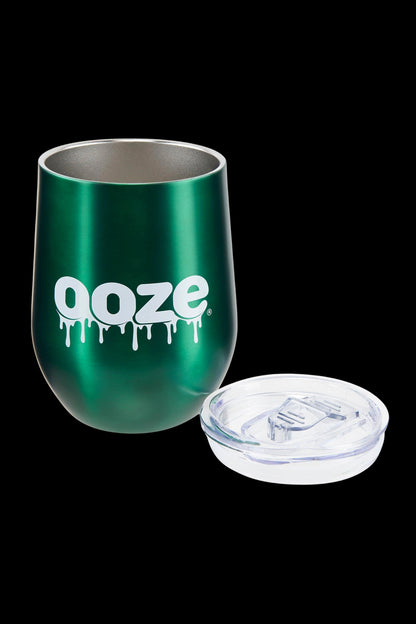 Dark green cannabis accessory cup with “ooze.” logo and clear lid.