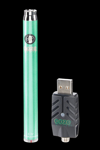Green cannabis vape pen and USB charging case.