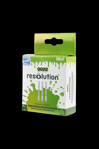 Angled front view of the green-and-white Ooze Resolution Alcohol Micro Swabs – 100ct box with a hanging tab against black background