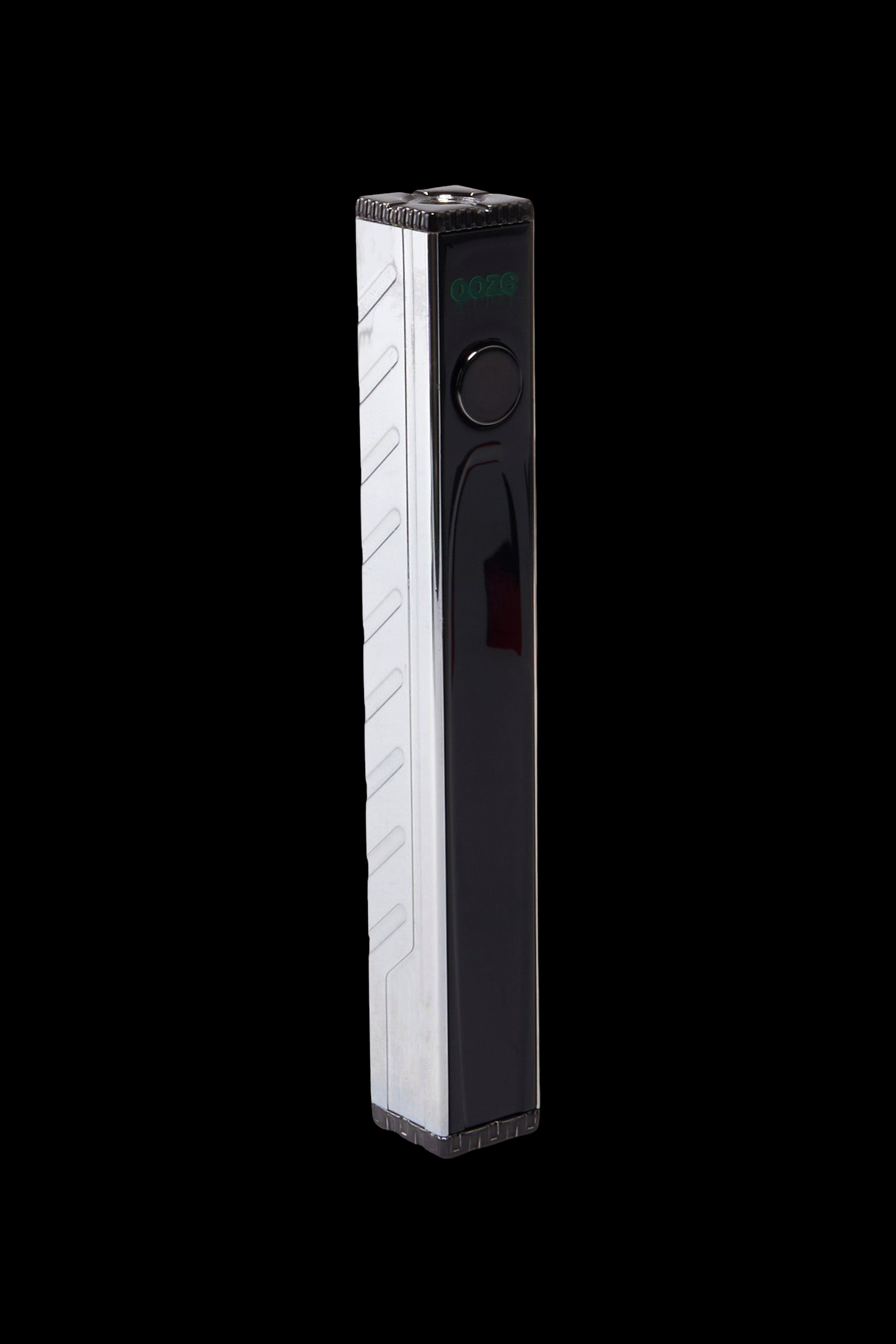 Sleek black and white cannabis vaporizer pen with digital display.