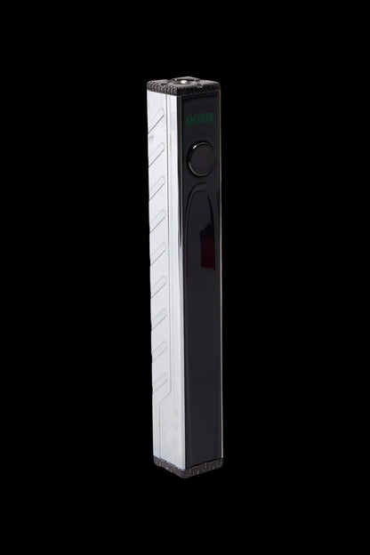 Sleek black and white cannabis vaporizer pen with digital display.