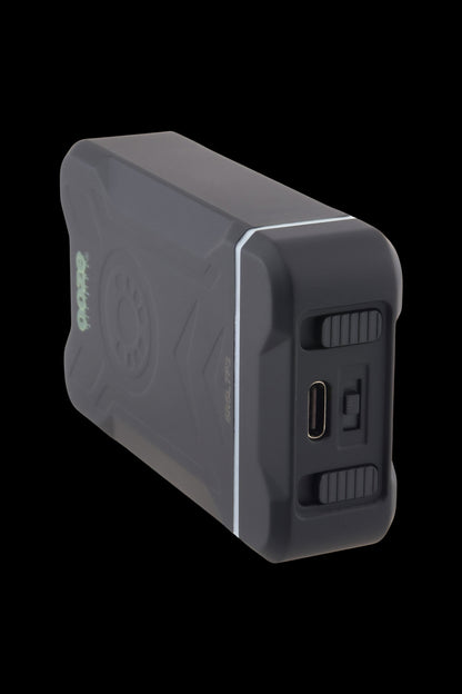 Angled close-up of the black Ooze Duet 510 Dual Conceal Cart Battery showing its corner USB-C port, textured side buttons, and white edge accent.