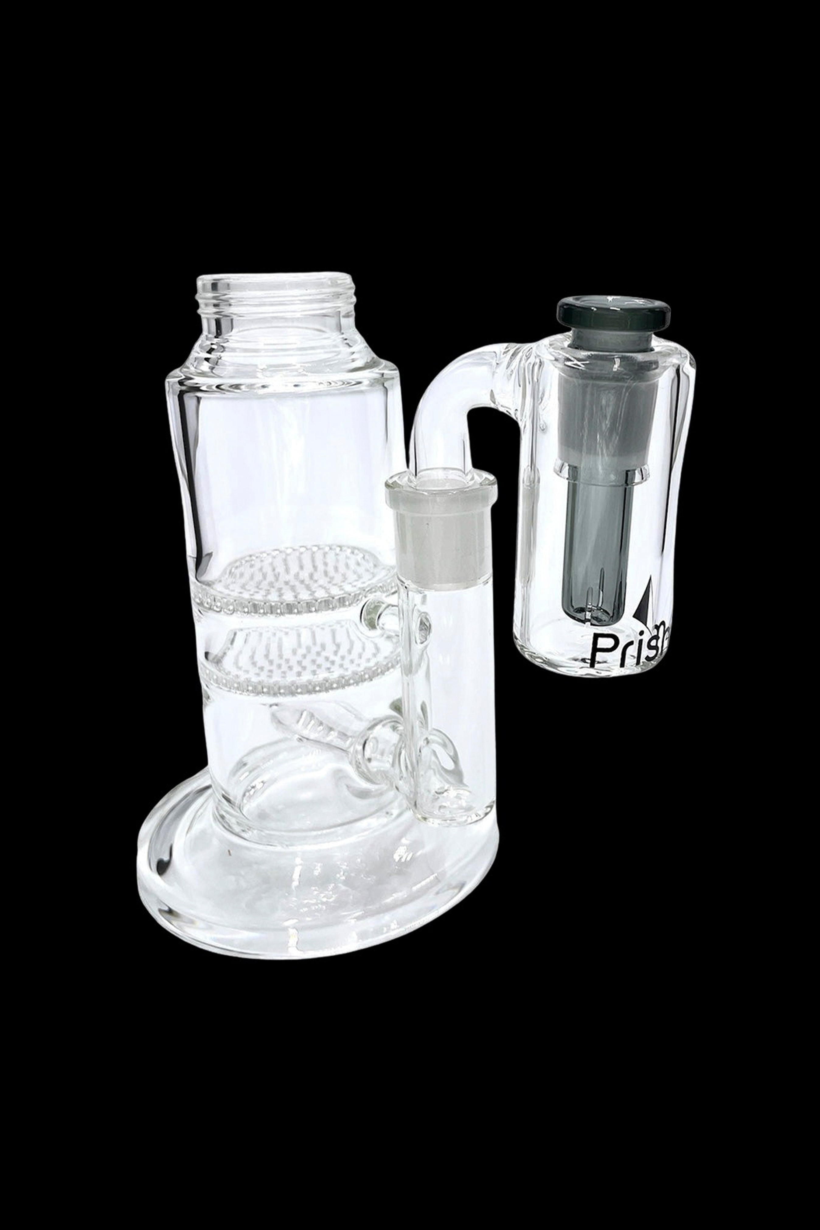 Glass bubbler water pipe with a removable downstem, isolated on a black background.