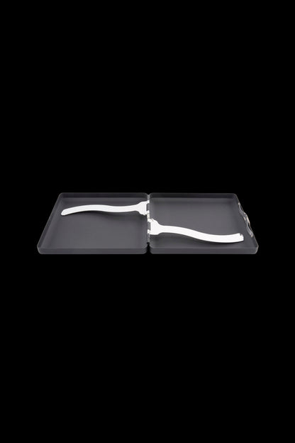 Top-down view of an open black Ooze Joint Case showing its hinged interior and two white curved metal clips against a black background