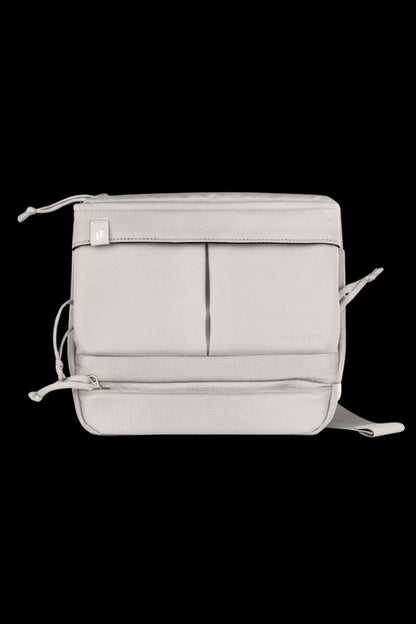 Light grey cannabis accessories bag with multiple pockets and adjustable straps.
