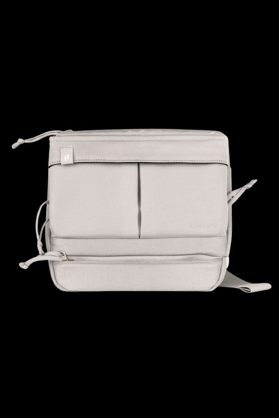 Light grey cannabis accessories bag with multiple pockets and adjustable straps.