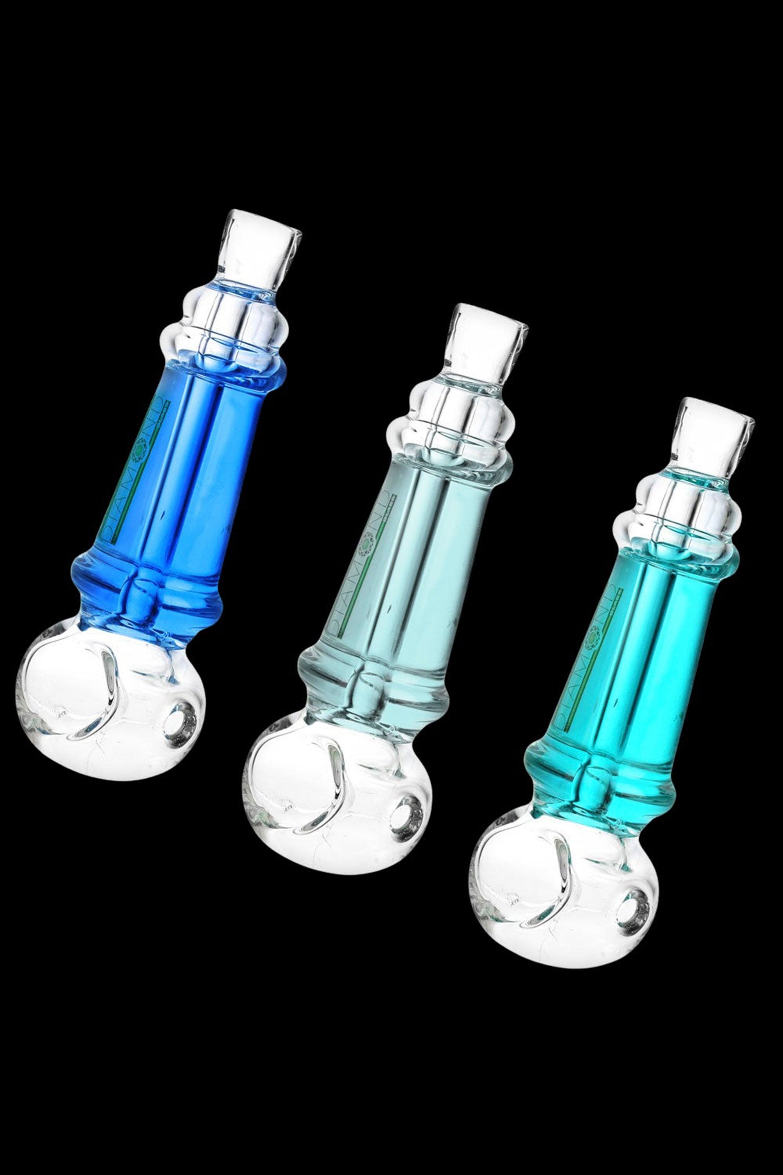 Three glass bubblers in shades of blue and teal against a black background.