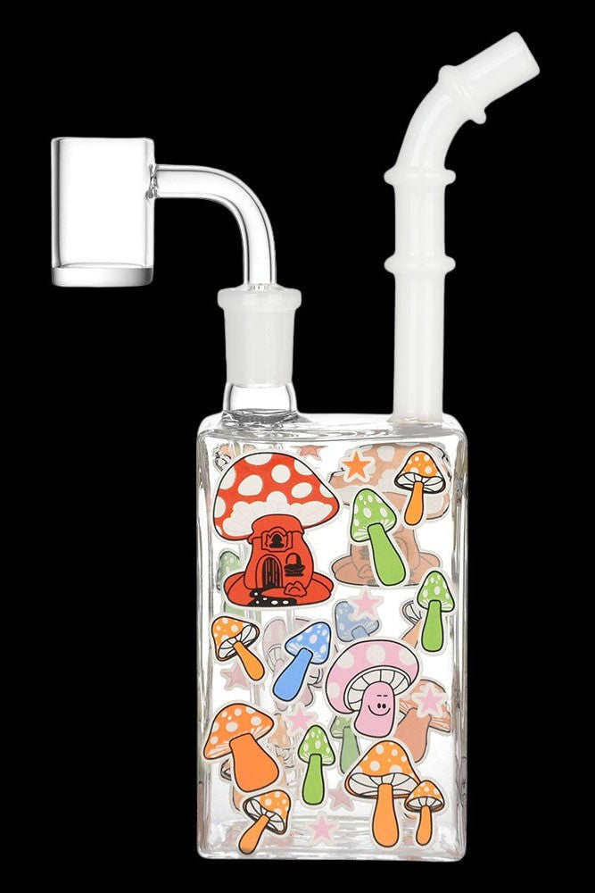 Clear glass water pipe (rig) with colorful mushroom-themed artwork, featuring a dab nail attachment.
