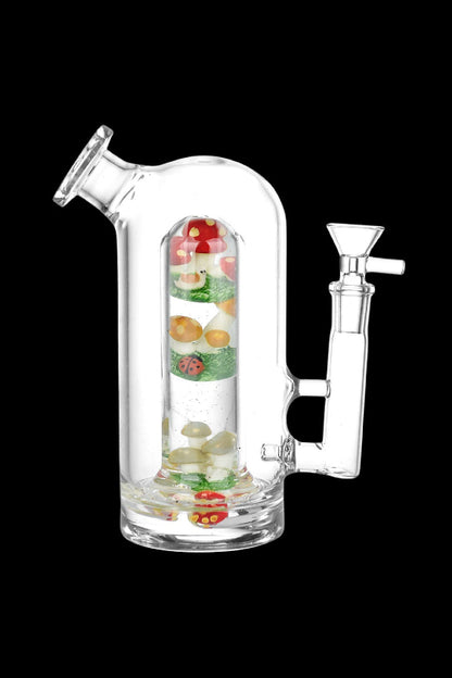 Glass bubbler water pipe filled with colorful mushroom-shaped confetti.
