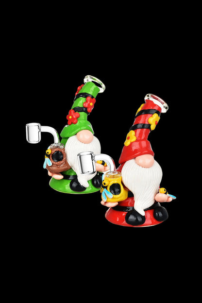Festive glass rigs shaped like Santa and elf gnomes with detailed sculpting and colorful accents.