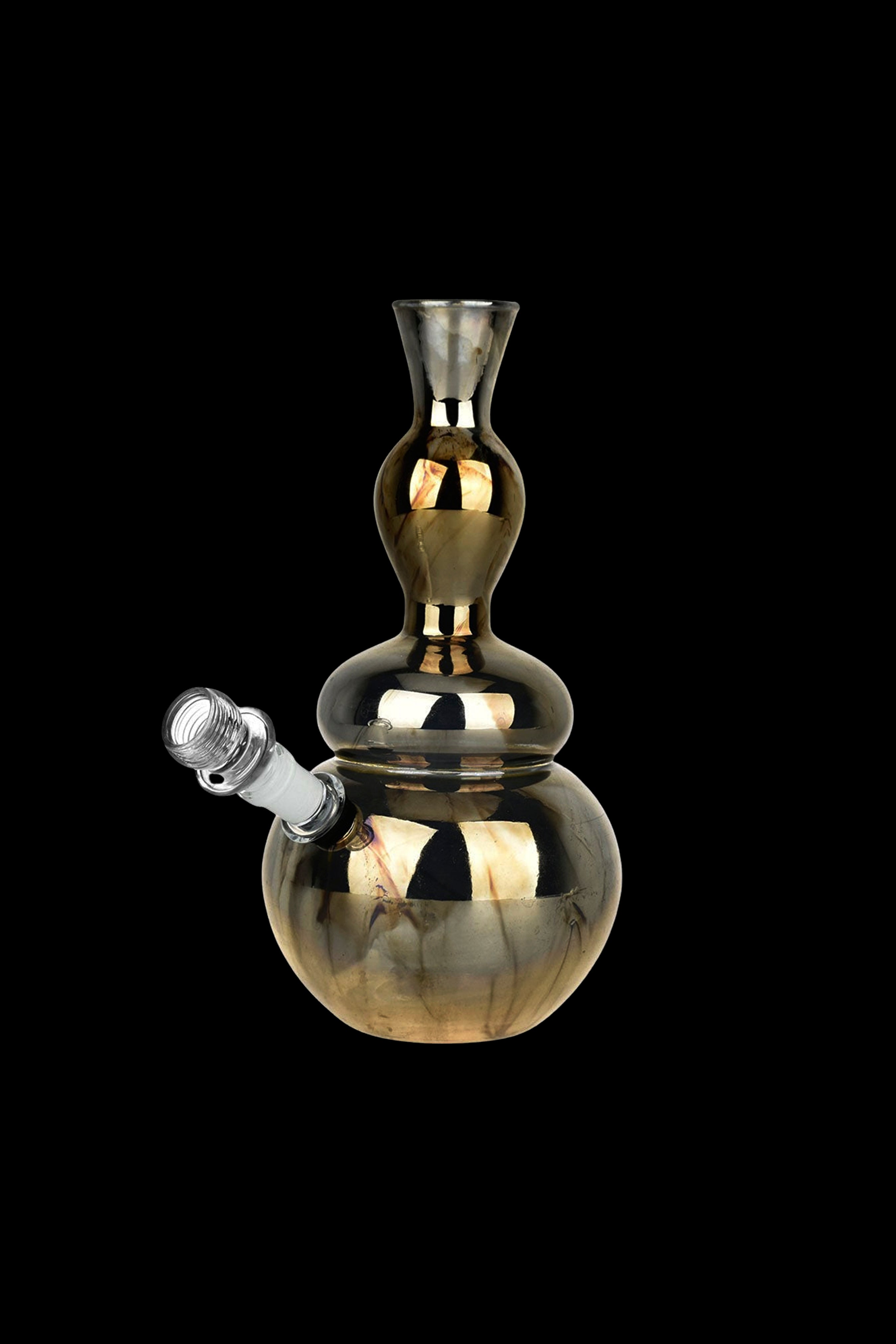 Gold-colored glass bubbler water pipe against a black background.