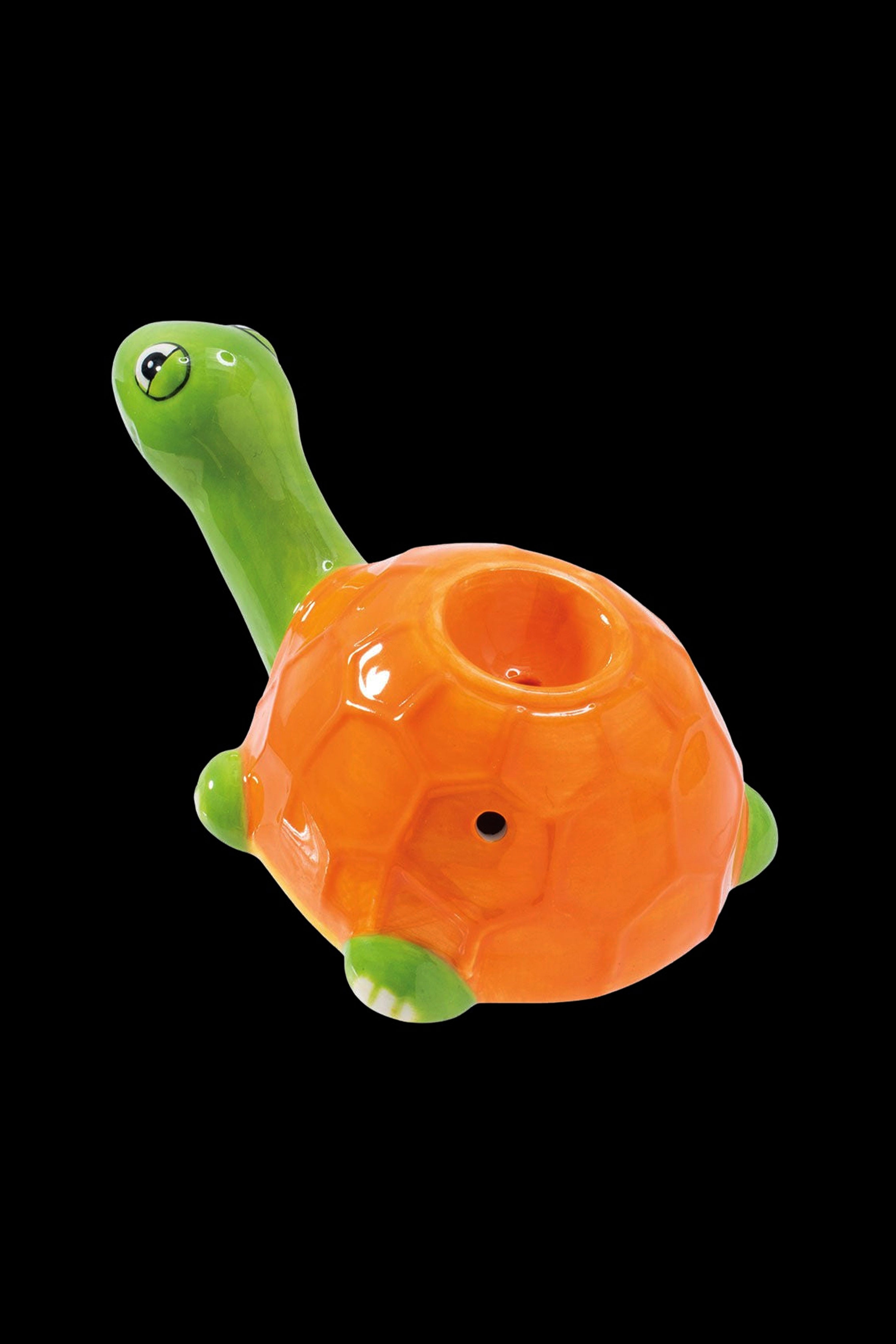 Orange and green turtle-shaped glass pipe.