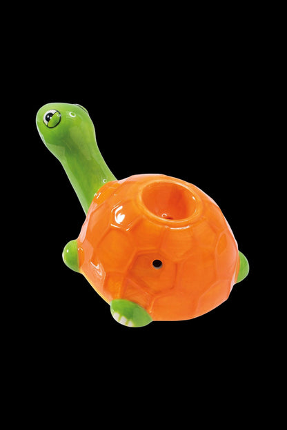 Orange and green turtle-shaped glass pipe.