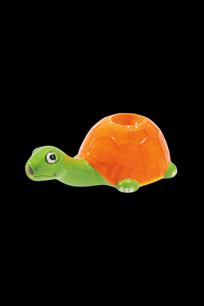 Orange and green glass turtle-shaped smoking piece.