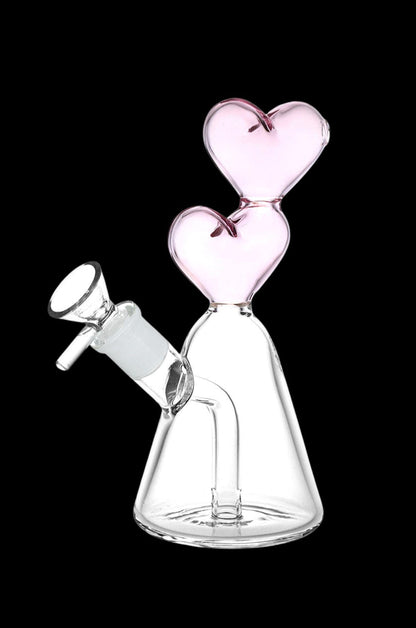 Pink glass water pipe with heart-shaped bubbles and a glass bowl.