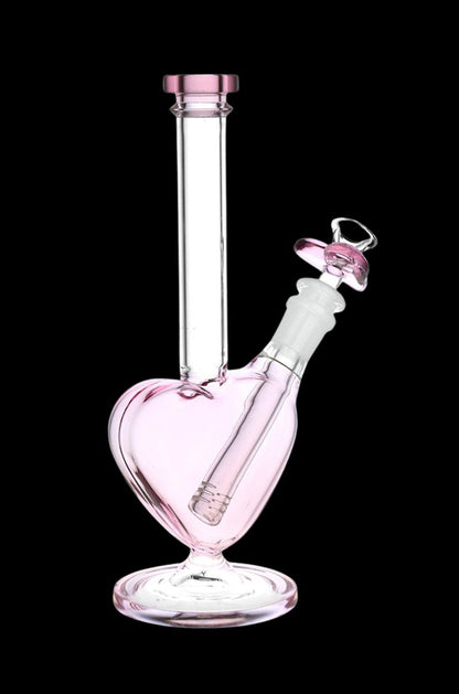 Pink glass water pipe (bong) with a downstem and mouthpiece against a black background.