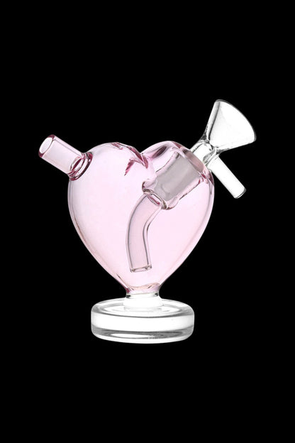 Pink glass heart-shaped bubbler for cannabis use.