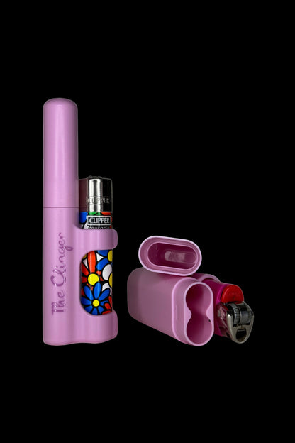 Purple cannabis one-hitter pipe with a colorful floral design, alongside a lighter and a protective case.
