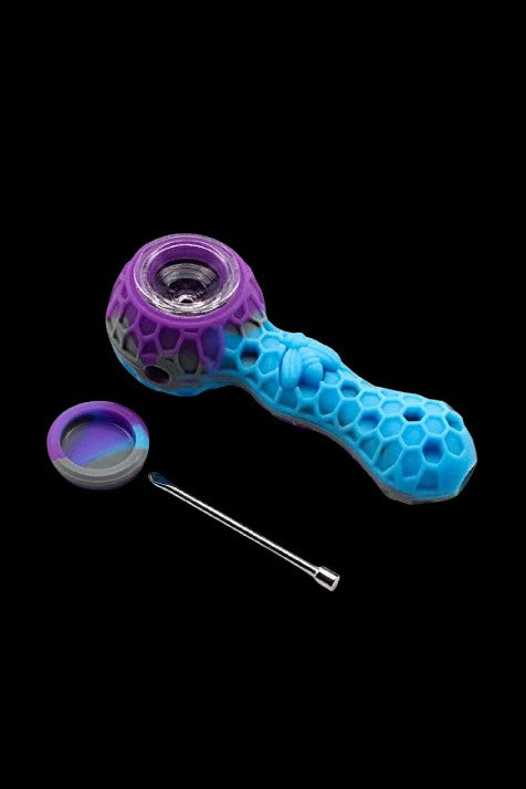Blue and purple silicone smoking pipe with a metal pick and collection dish on a black background.