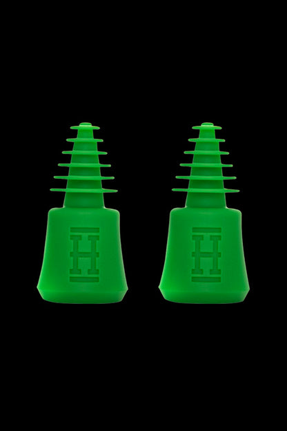 Two green silicone hash oil rig tips for dabbing cannabis concentrates.
