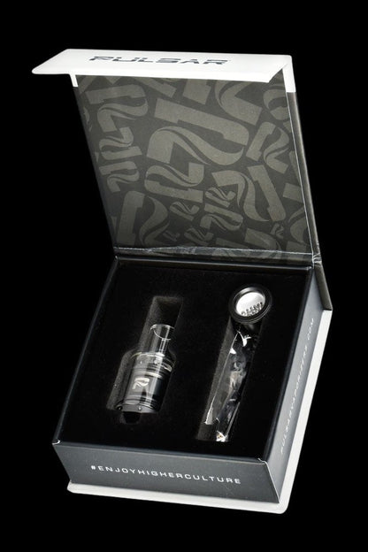 Open black box displaying a cannabis oil burner and accessories, branded with "#ENJOYHIGHERCULTURE".