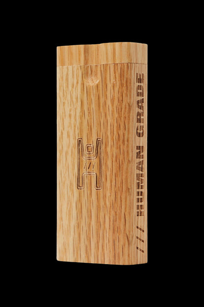 Wooden one-hitter pipe with “Human Grade” text engraved on the side.