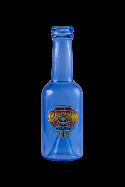 Blue glass bottle with a retro-style “Toxic Crush” label featuring a skull and crossbones, likely used for cannabis concentrates.
