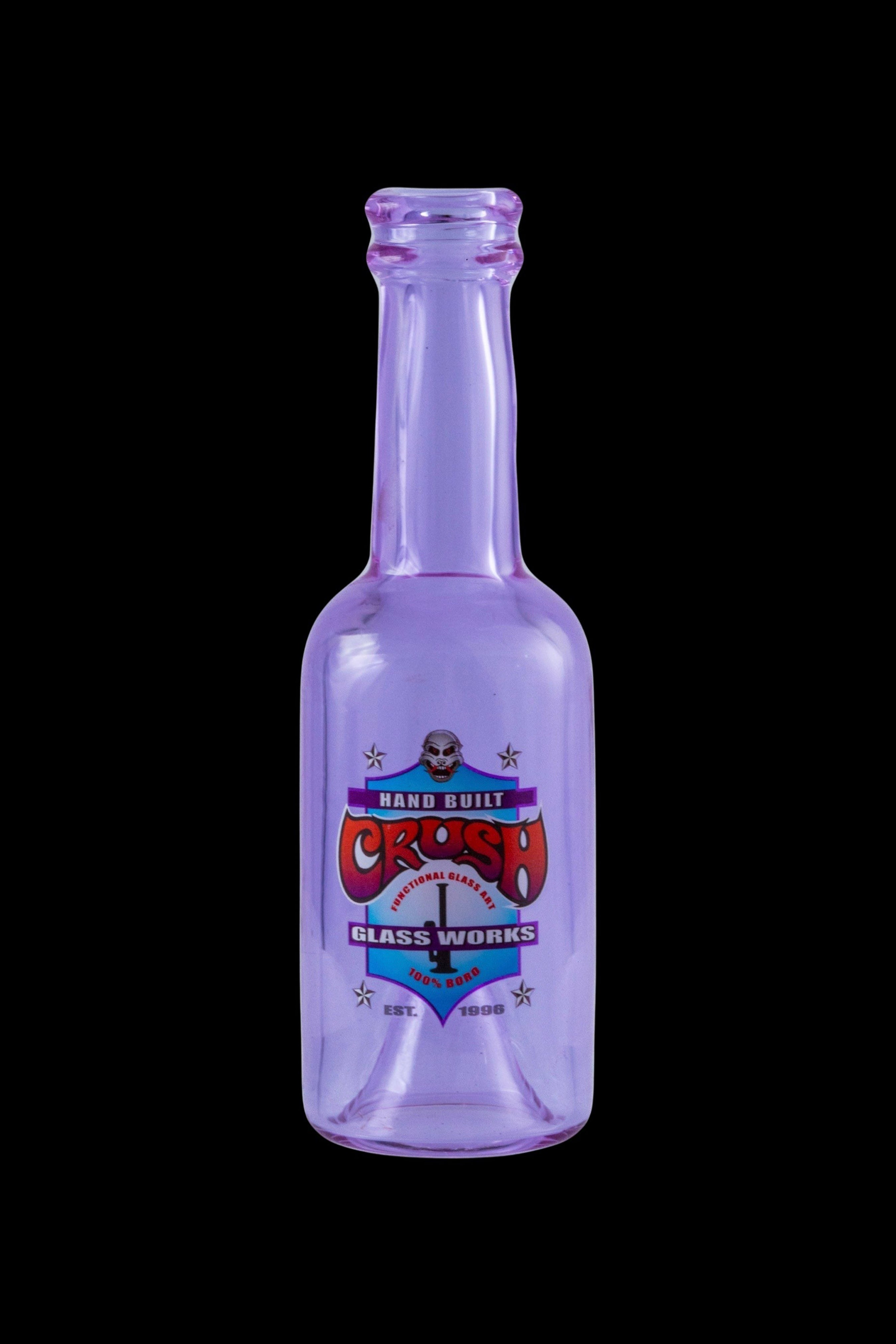 Purple glass bottle with a colorful "Crash Glassworks" label, likely for cannabis concentrates.