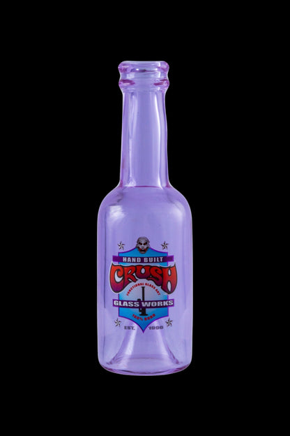 Purple glass bottle with a colorful "Crash Glassworks" label, likely for cannabis concentrates.